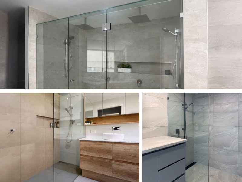 A bathroom with marble tiles, a built-in bench and clear glass panels after installing a shower screen.